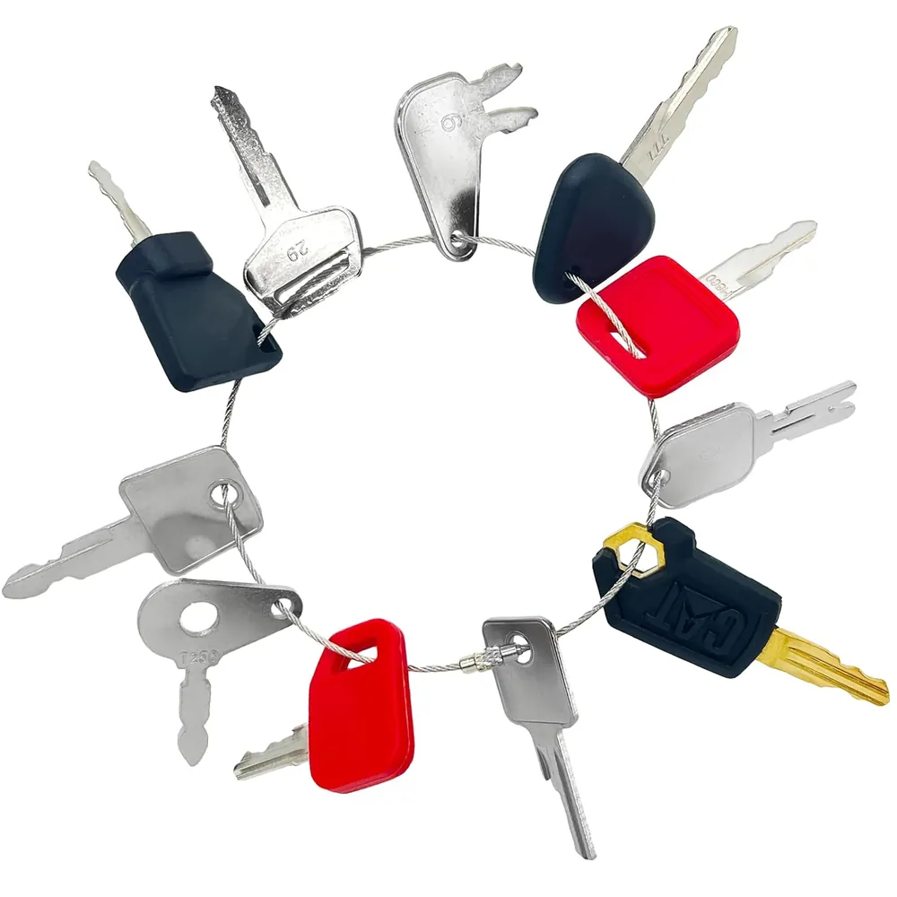 Close-up of construction equipment keys: number-stamped silver keys and colored plastic-head keys