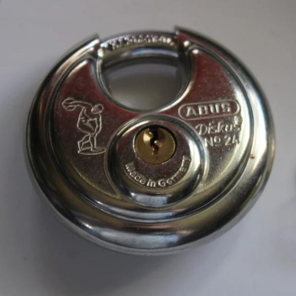 ABUS Diskus stainless steel disc padlock with a brass pin tumbler cylinder
