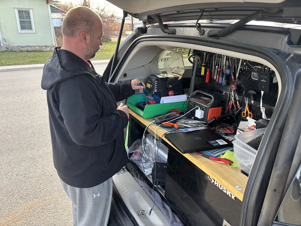 Spare Me locksmith working from the open van workstation